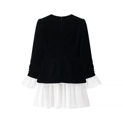 Women’s velvet dress with fitted bodice, puff sleeves, and layered ruffle skirt Shop Velvia