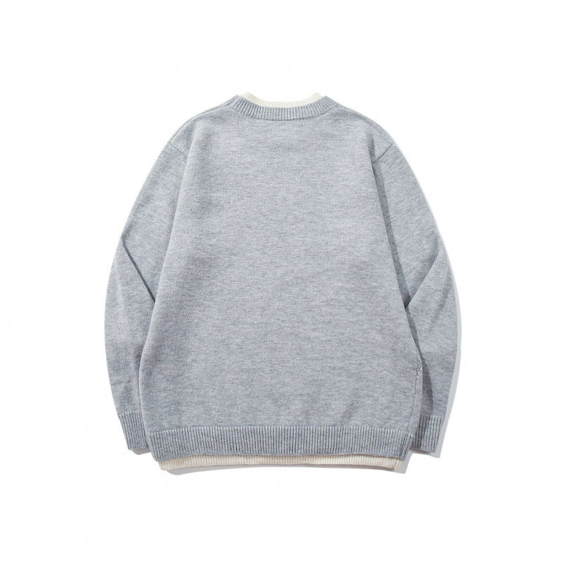 Unisex fine knit sweater with raglan seam and triangular hem adornment Shop Velvia