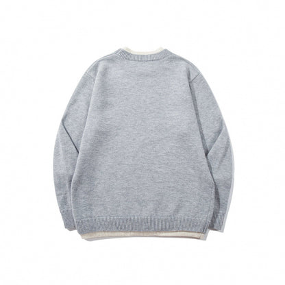 Unisex fine knit sweater with raglan seam and triangular hem adornment Shop Velvia