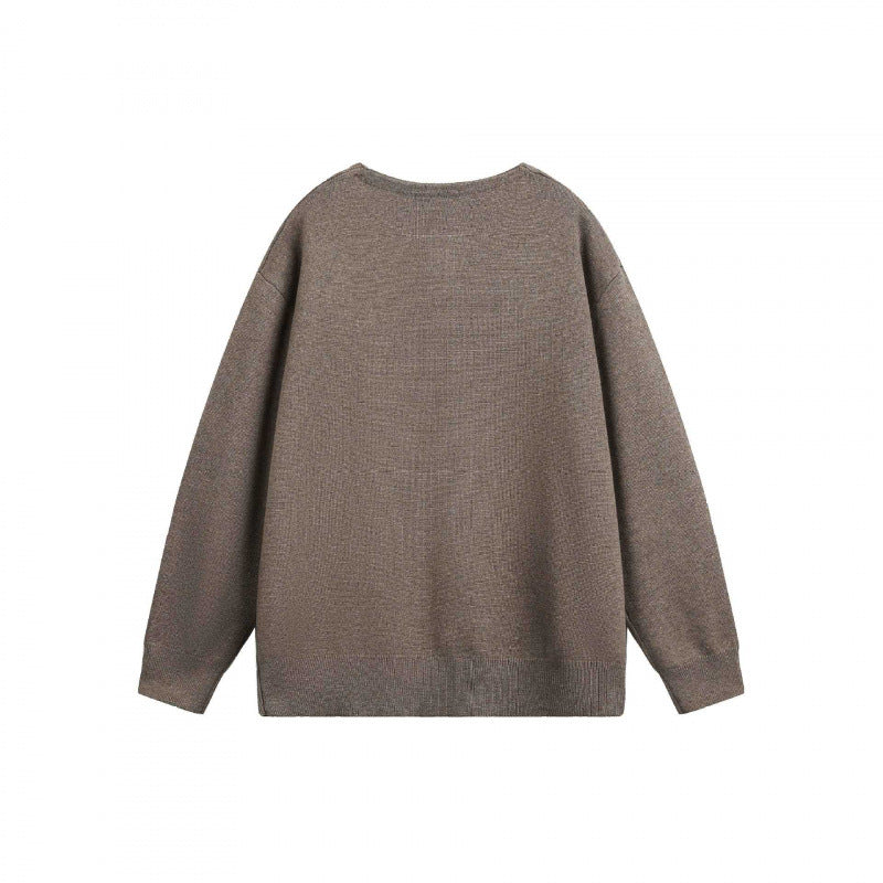 Unisex Oversize fine knit pullover with short Henley closure and structured mélange quality Shop Velvia