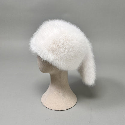 Women’s plush faux fur trapper hat with earflaps and decorative tail Shop Velvia