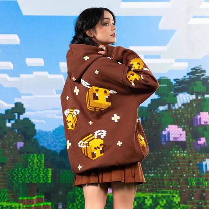Unisex hoodie with knitted pixel bee design and attached kangaroo pocket Shop Velvia