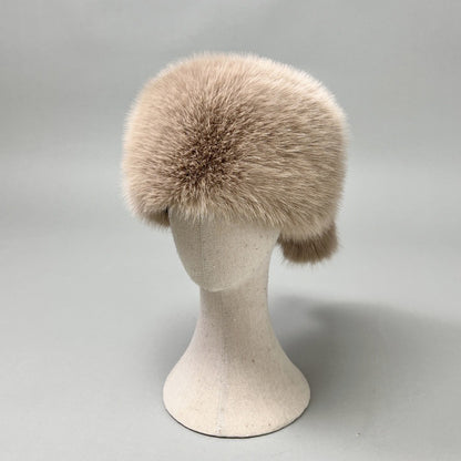 Women’s plush faux fur trapper hat with earflaps and decorative tail Shop Velvia