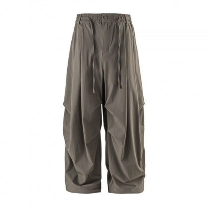 Unisex Loose-fitting technical cargo pants with elastic waistband, drawstring, and zip pockets Shop Velvia