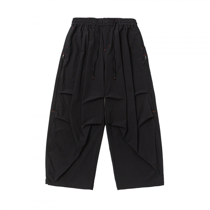 Unisex Loose-fitting technical cargo pants with elastic waistband, drawstring, and zip pockets Shop Velvia