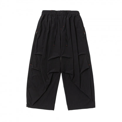 Unisex Loose-fitting technical cargo pants with elastic waistband, drawstring, and zip pockets Shop Velvia