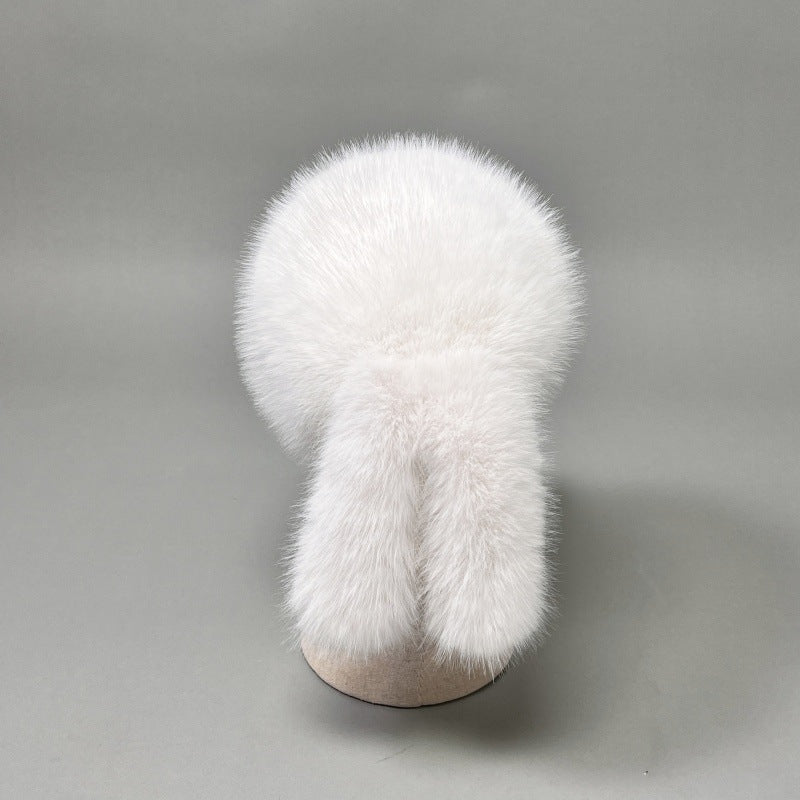 Women’s plush faux fur trapper hat with earflaps and decorative tail Shop Velvia