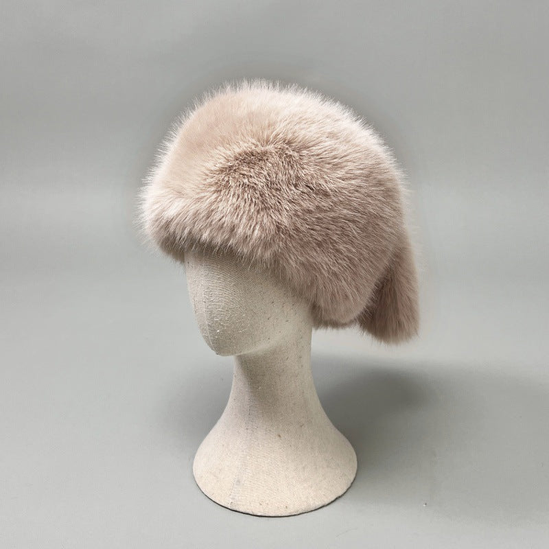 Women’s plush faux fur trapper hat with earflaps and decorative tail Shop Velvia