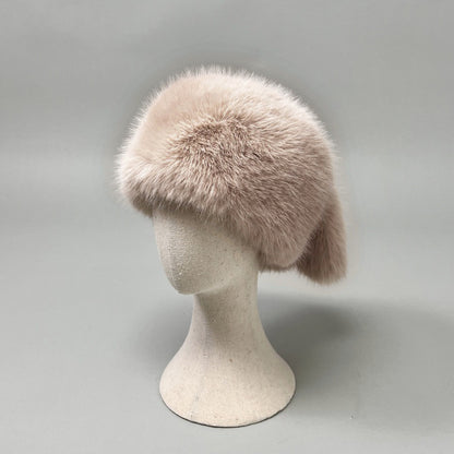 Women’s plush faux fur trapper hat with earflaps and decorative tail Shop Velvia