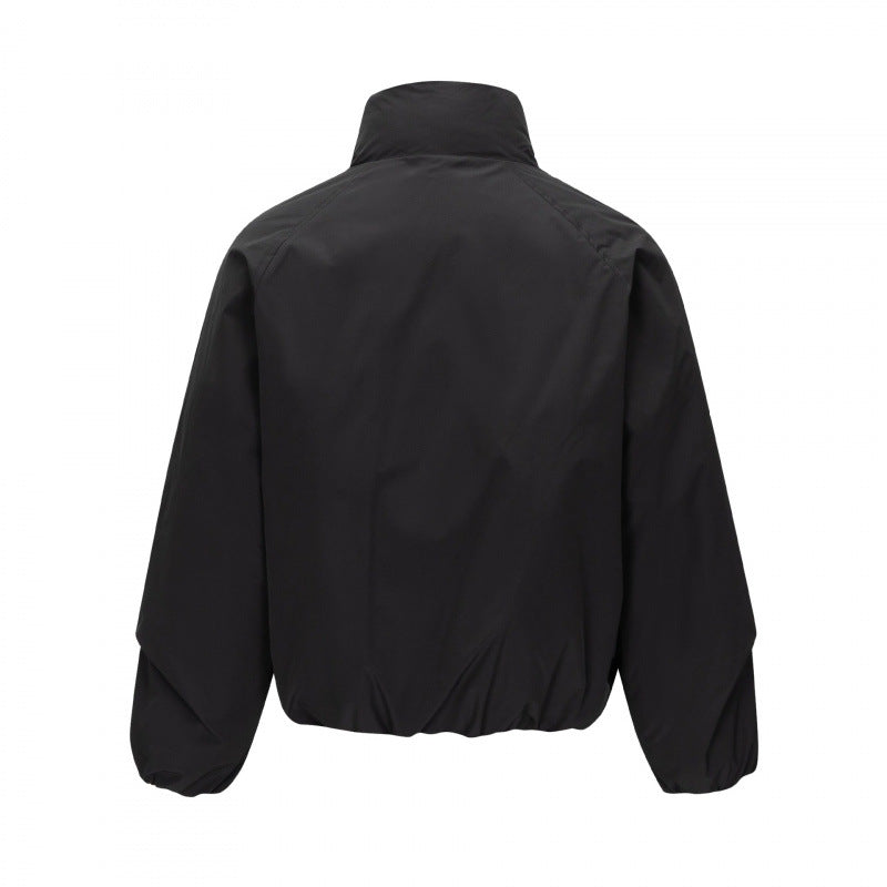 Unisex Short cut lightweight windbreaker in boxy cut with high stand-up collar and elastic hem Shop Velvia