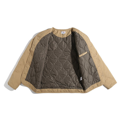 Unisex Lightly Quilted Round Neck Transitional Jacket with Button Placket and Patch Pockets Shop Velvia