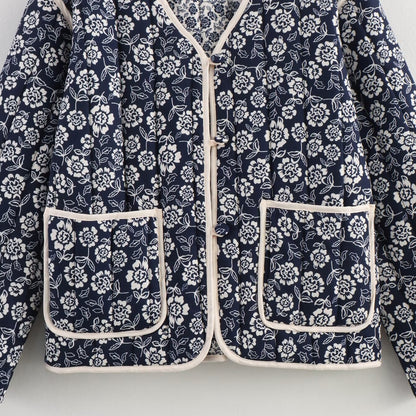 Ladies quilted jacket with floral allover, V-neck, contrast piping and patch pockets Shop Velvia