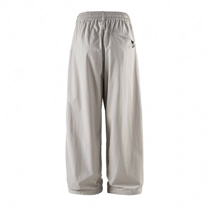 Unisex Loose-fitting technical cargo pants with elastic waistband, drawstring, and zip pockets Shop Velvia
