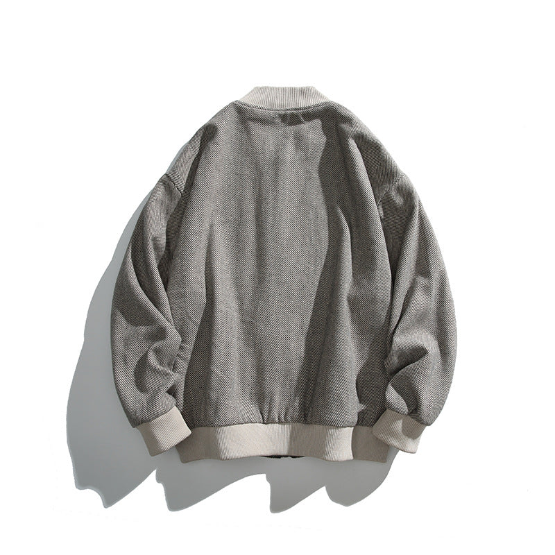Unisex boxy bomber jacket in herringbone look with ribbed cuffs, flap pockets, and concealed snap button placket Shop Velvia