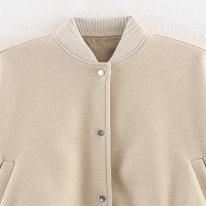 Ladies short boxy bomber jacket with ribbed collar, snap button closure, and pockets Shop Velvia