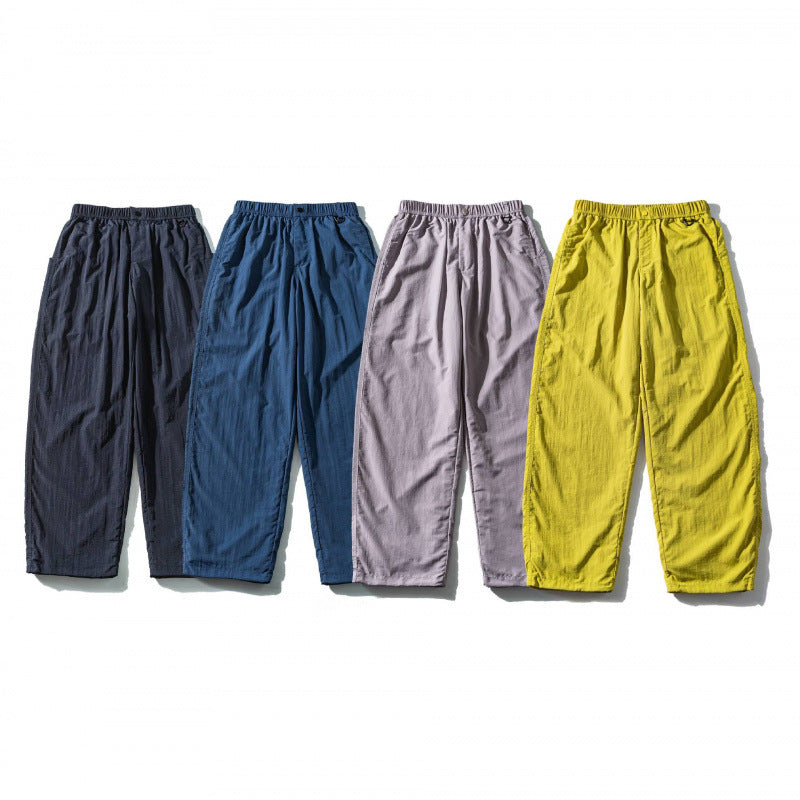 Unisex Loose Crinkle Pants with elastic drawstring waistband, drop-crotch, and side pockets Shop Velvia