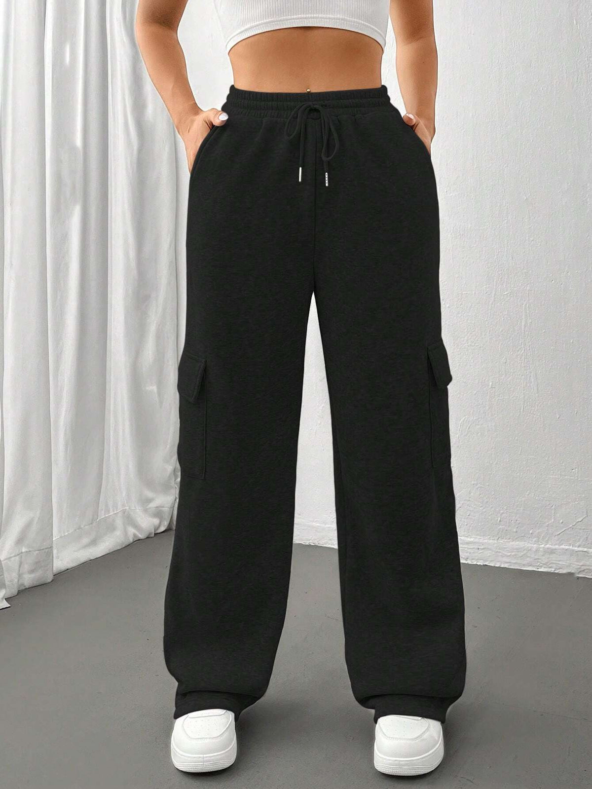 Ladies cargo jogging pants with high elastic waistband, drawstring, and wide leg Shop Velvia