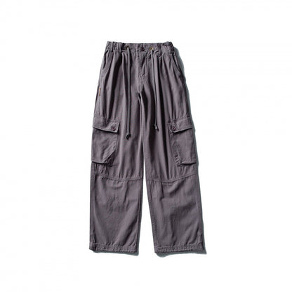Men's cargo pants with wide leg, elastic drawstring waistband, and patch flap pockets Shop Velvia