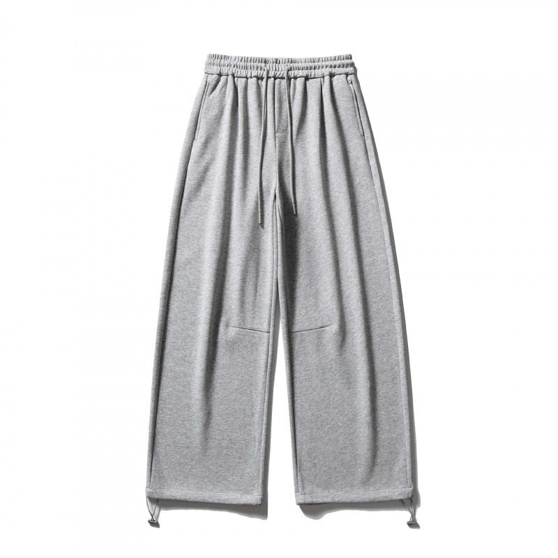 Unisex Wide Sweatpants with drawstring waistband, cord drawstring, and adjustable leg straps Shop Velvia
