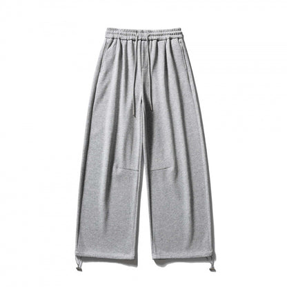 Unisex Wide Sweatpants with drawstring waistband, cord drawstring, and adjustable leg straps Shop Velvia