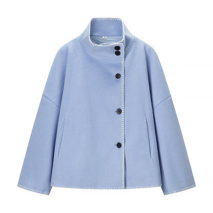 Women's short cape coat with stand collar, contrasting decorative stitch edge, and oversized sleeves Shop Velvia