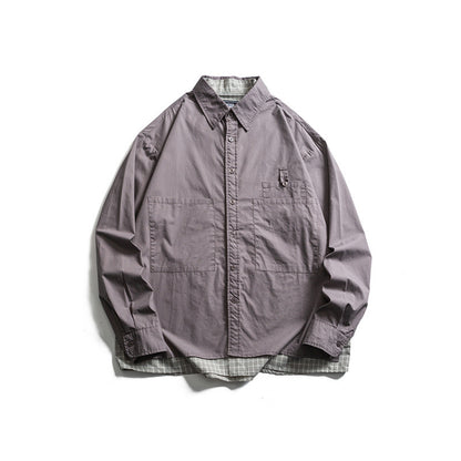 Men's layered look overshirt with patch front pockets, loose fit and checked underlay Shop Velvia