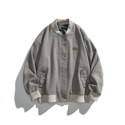 Unisex boxy bomber jacket in herringbone look with ribbed cuffs, flap pockets, and concealed snap button placket Shop Velvia