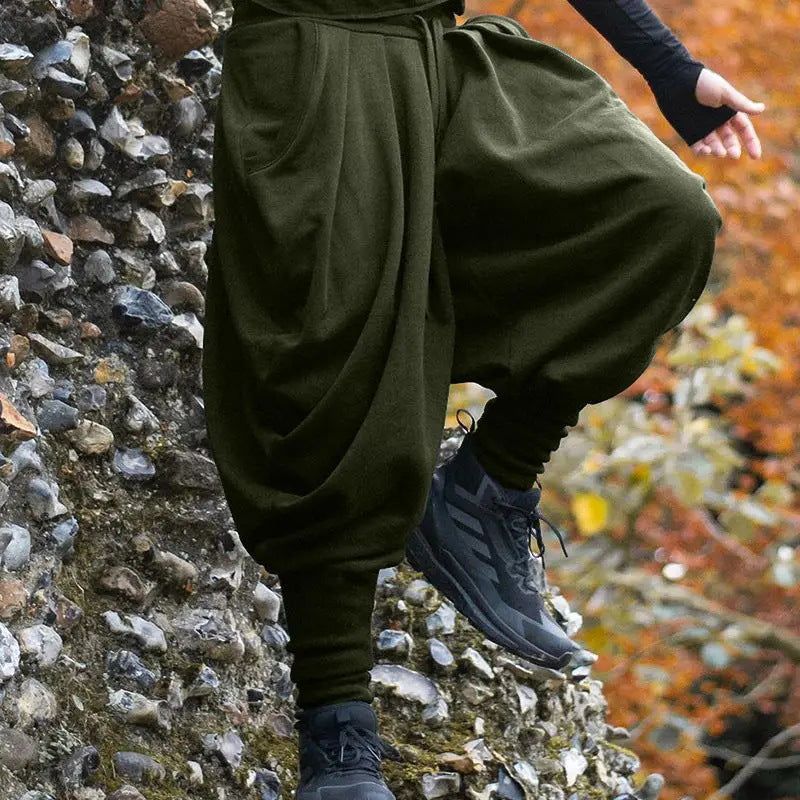 Men's nan avant-garde harem pants with wrap front, elastic waistband, and slim lower leg Shop Velvia