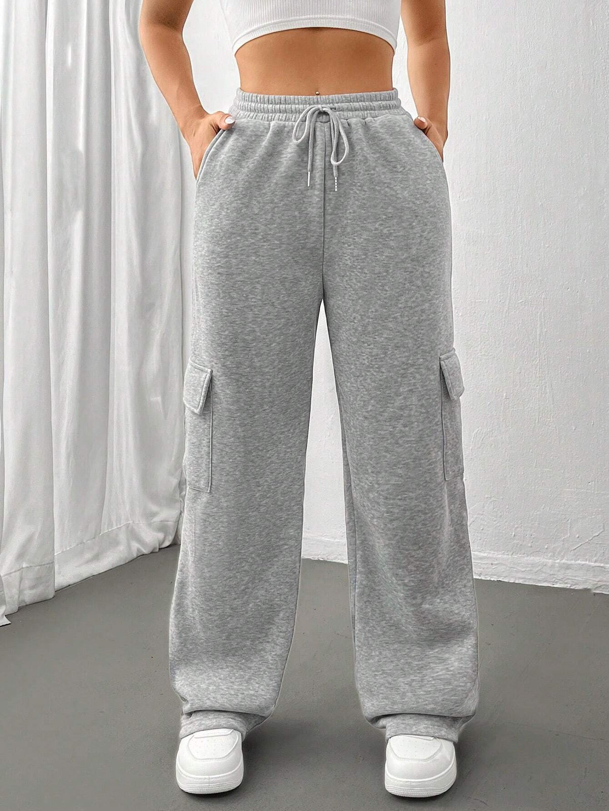Ladies cargo jogging pants with high elastic waistband, drawstring, and wide leg Shop Velvia