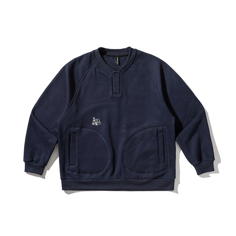 Unisex Oversize Henley Sweatshirt with raglan sleeves, button placket, and distinctive round pockets Shop Velvia