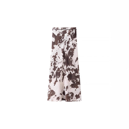 Women's loosely cut shirt blouse with cow spot print and concealed button placket Shop Velvia