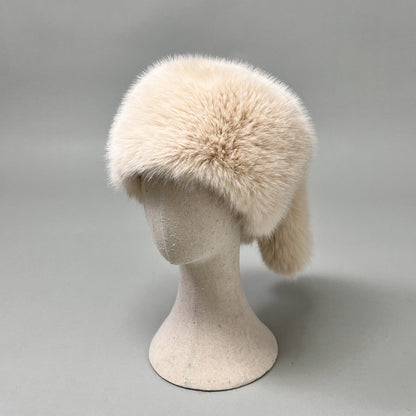 Women’s plush faux fur trapper hat with earflaps and decorative tail Shop Velvia