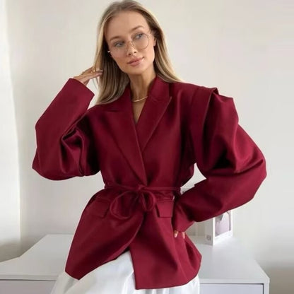 Women's blazer with shoulder cutouts, belted waist and single button closure Shop Velvia