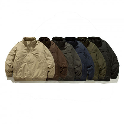 Unisex Boxy-padded transition jacket with high stand-up collar and utility pockets Shop Velvia