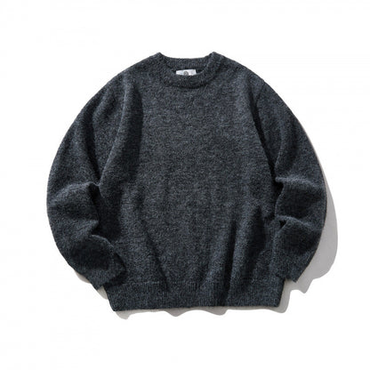 Unisex Oversize fine knit sweater with round neckline, ribbed cuffs, and mottled wool blend Shop Velvia