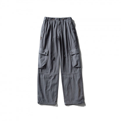 Men's cargo pants with wide leg, elastic drawstring waistband, and patch flap pockets Shop Velvia