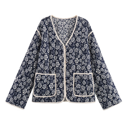 Ladies quilted jacket with floral allover, V-neck, contrast piping and patch pockets Shop Velvia
