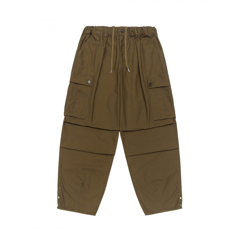 Unisex Oversize Cargo Pants with drawstring waistband, layer detail and snap hem Shop Velvia