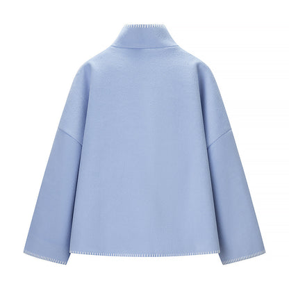 Women's short cape coat with stand collar, contrasting decorative stitch edge, and oversized sleeves Shop Velvia