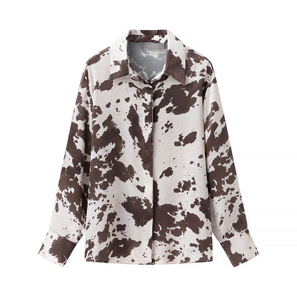 Women's loosely cut shirt blouse with cow spot print and concealed button placket Shop Velvia