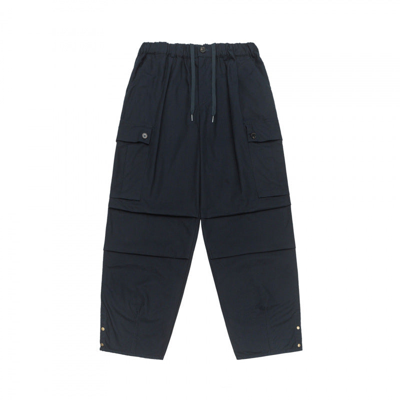Unisex Oversize Cargo Pants with drawstring waistband, layer detail and snap hem Shop Velvia