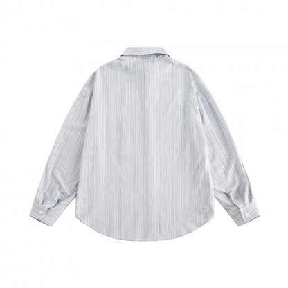 Unisex Oversize striped shirt with chest pocket and rounded hem Shop Velvia