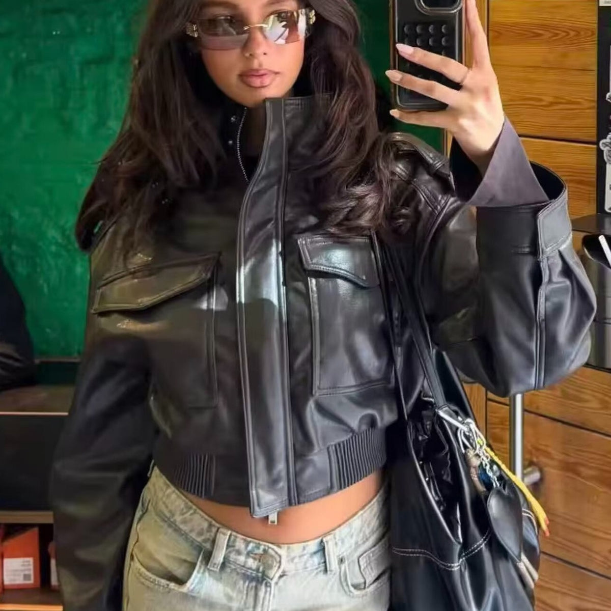 Women Short-Cut Leather Bomber with High Stand Collar, Shoulder Straps and Flap Pockets Shop Velvia