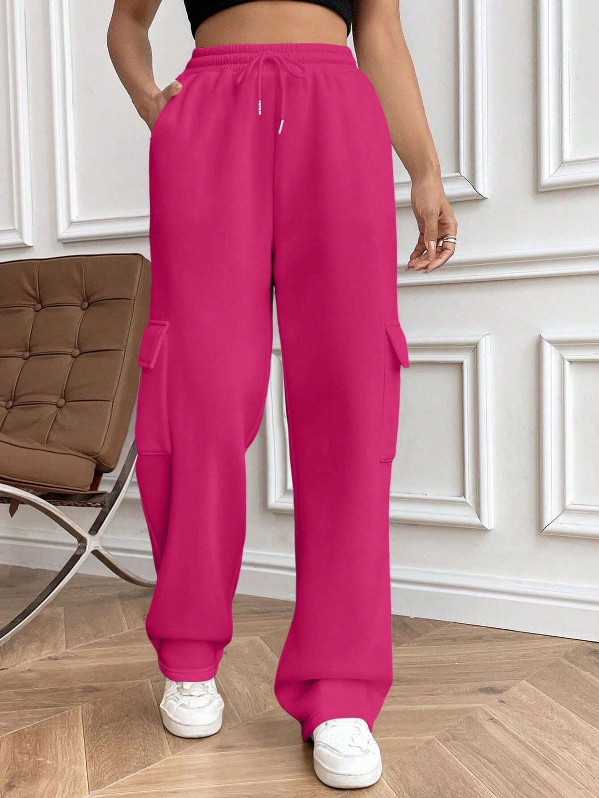 Ladies cargo jogging pants with high elastic waistband, drawstring, and wide leg Shop Velvia