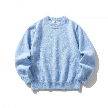 Unisex Oversize fine knit sweater with round neckline, ribbed cuffs, and mottled wool blend Shop Velvia