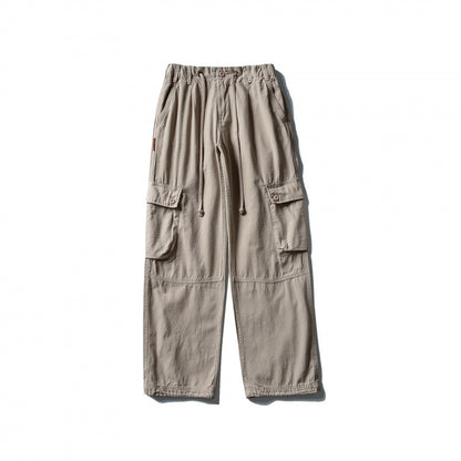 Men's cargo pants with wide leg, elastic drawstring waistband, and patch flap pockets Shop Velvia
