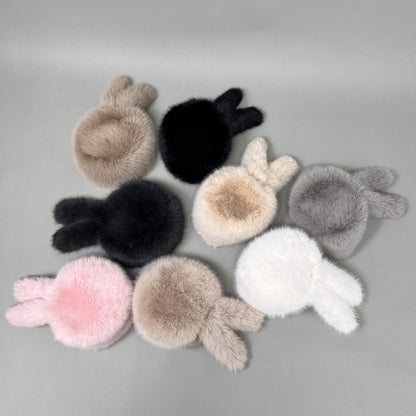 Women’s plush faux fur trapper hat with earflaps and decorative tail Shop Velvia