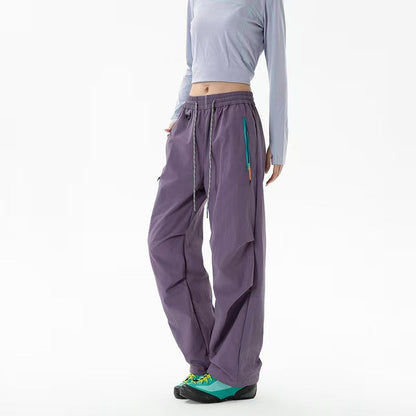 Loose trekking pants with water-repellent quick-drying coating, elastic drawstring waist, and zippered pockets Shop Velvia