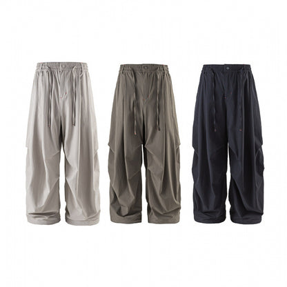 Unisex Loose-fitting technical cargo pants with elastic waistband, drawstring, and zip pockets Shop Velvia