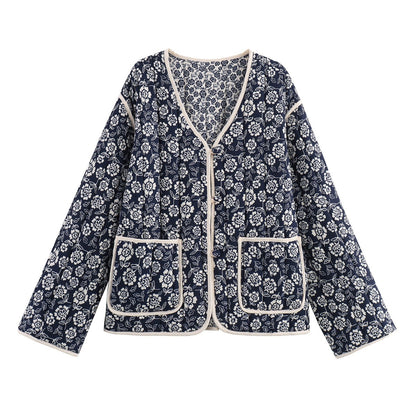 Ladies quilted jacket with floral allover, V-neck, contrast piping and patch pockets Shop Velvia